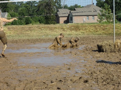 Participants Rolling Around in the Mud