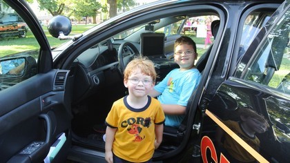 Kids Sitting in the Police Cruiser