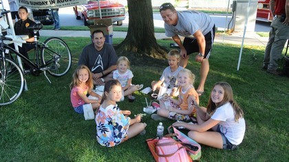 Participants Sitting Under a Tree
