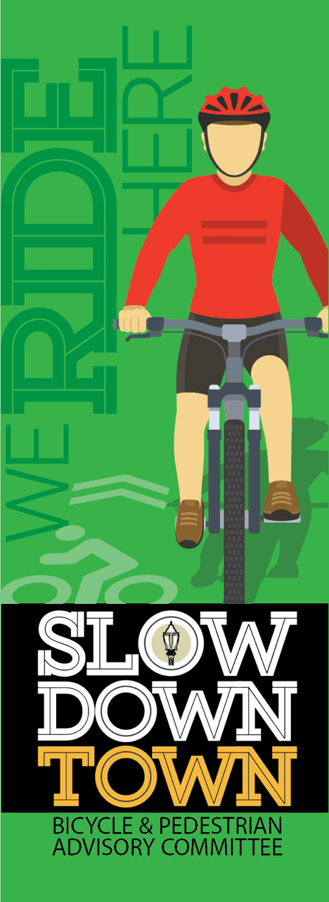 Slow Down Town banner for cyclists