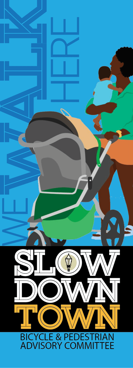 Slow Down Town banner for pedestrians