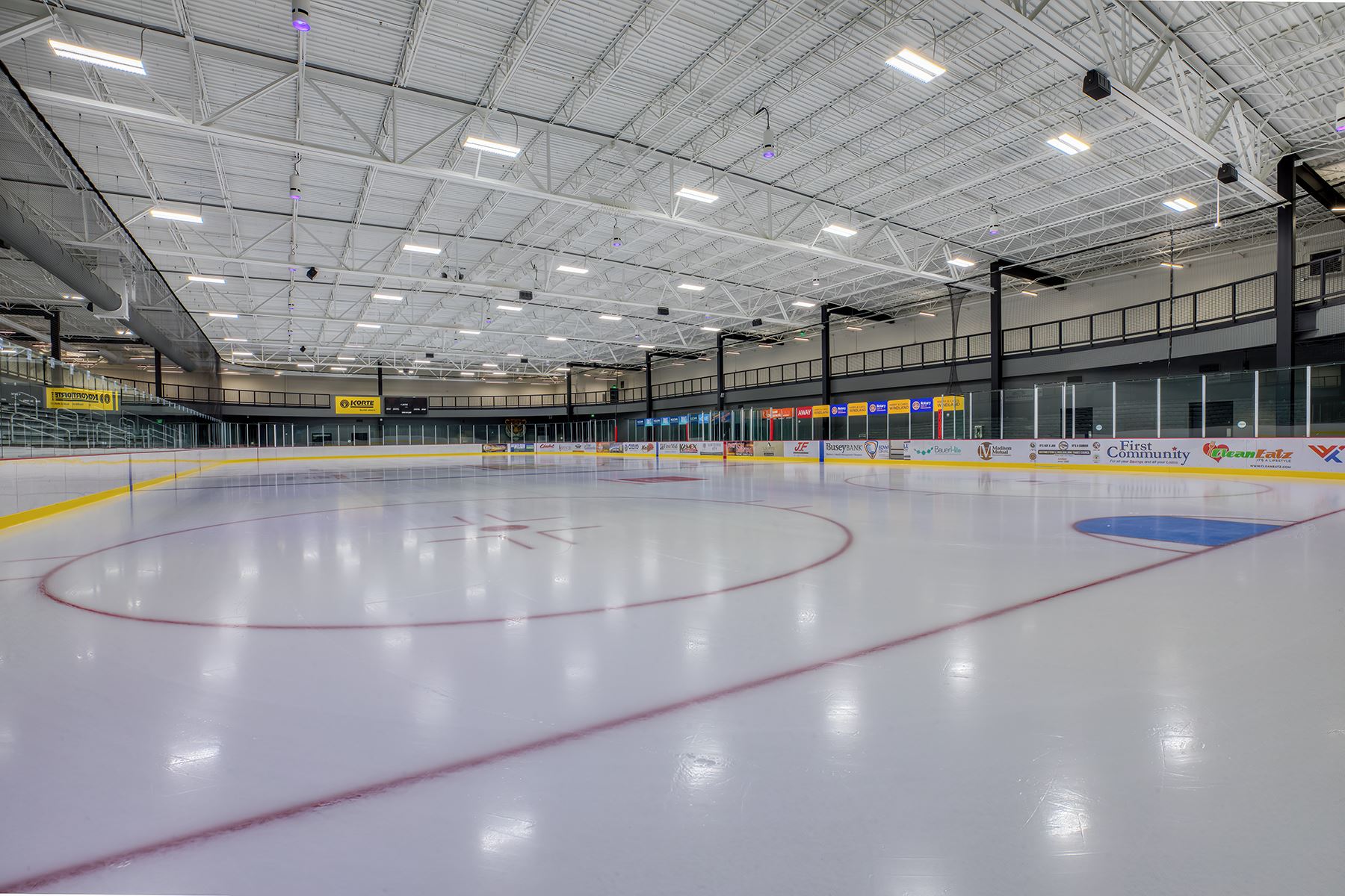 An image of a brightly lit empty indoor ice rink