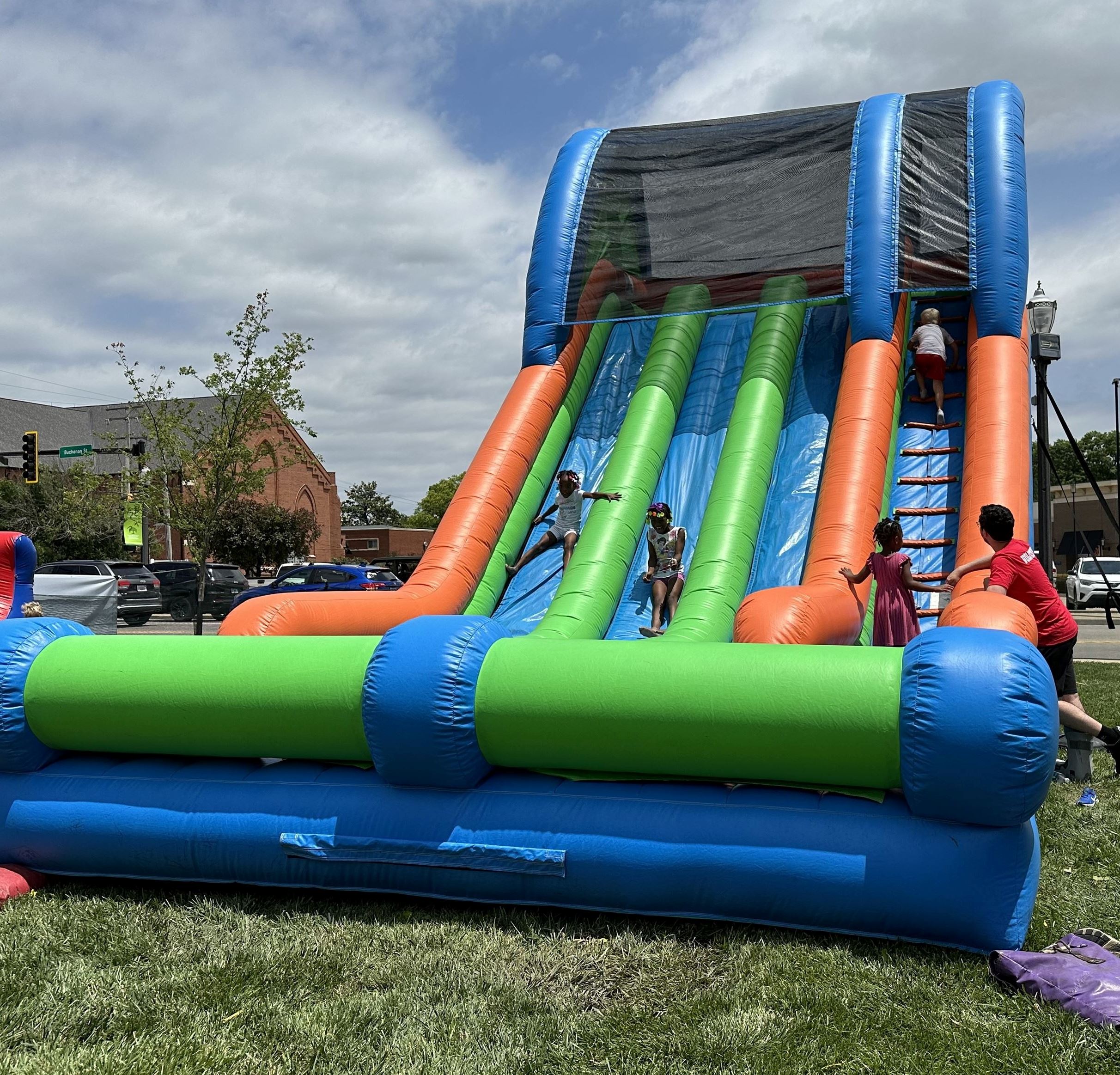 Children climb and slide on a bounce house at the Edwardsville Route 66 Festival